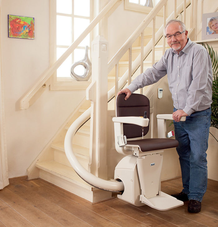 Customer riding a stair lift